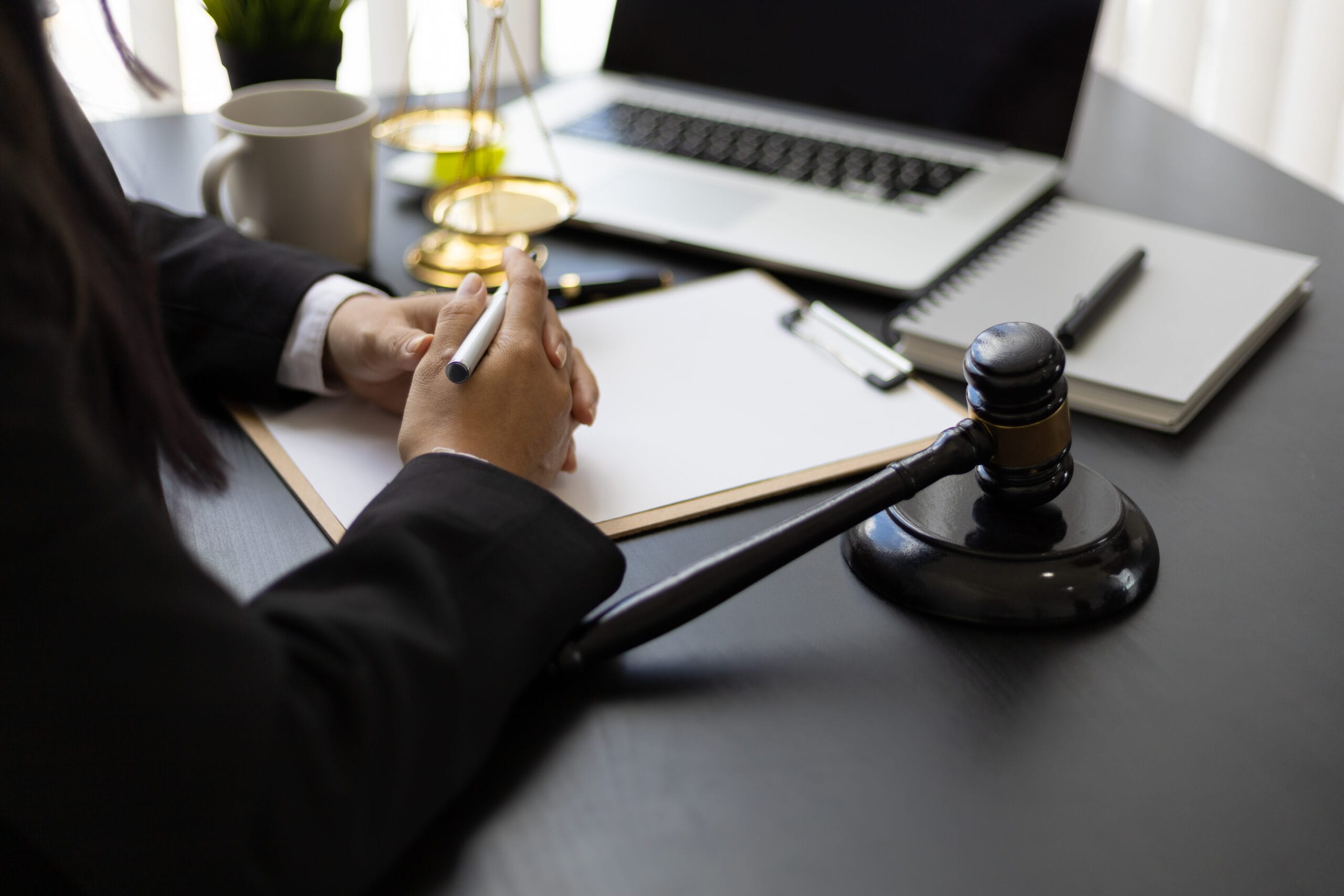 Attorney working on a desk in a law firm. abogados en sevilla